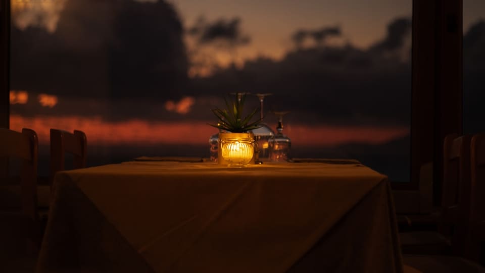 Private overwater dinner at sunset in the Maldives